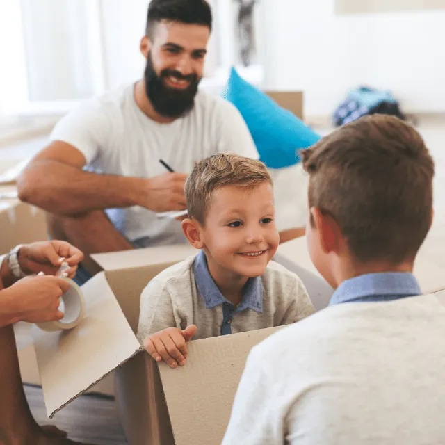 family and boy inside box