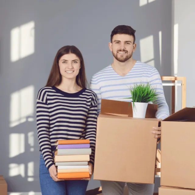 couple holding boxes